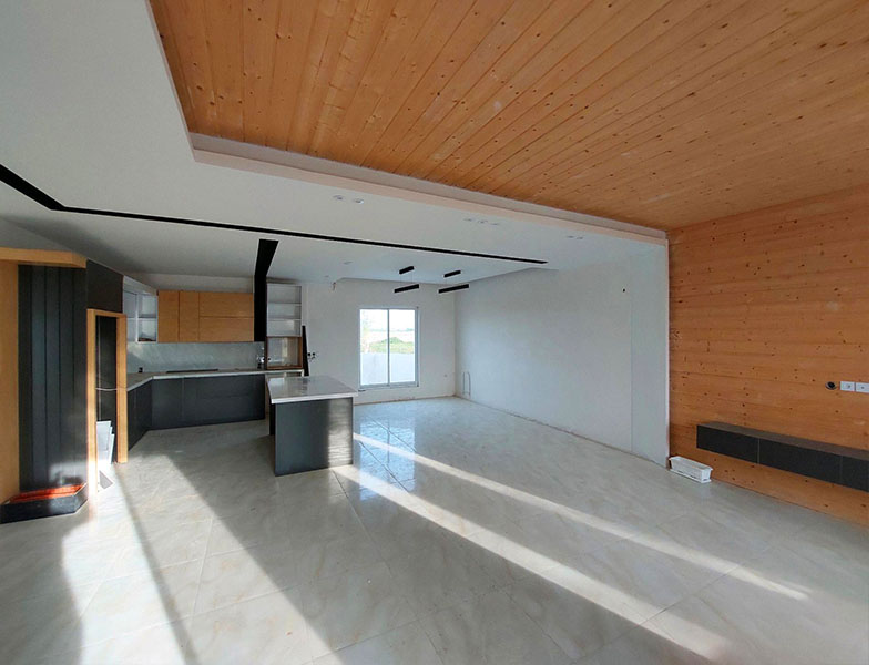 تصویر یک ویلای نما مدرن و محوطه سازی شده با موزاییک و چمن مصنوعی